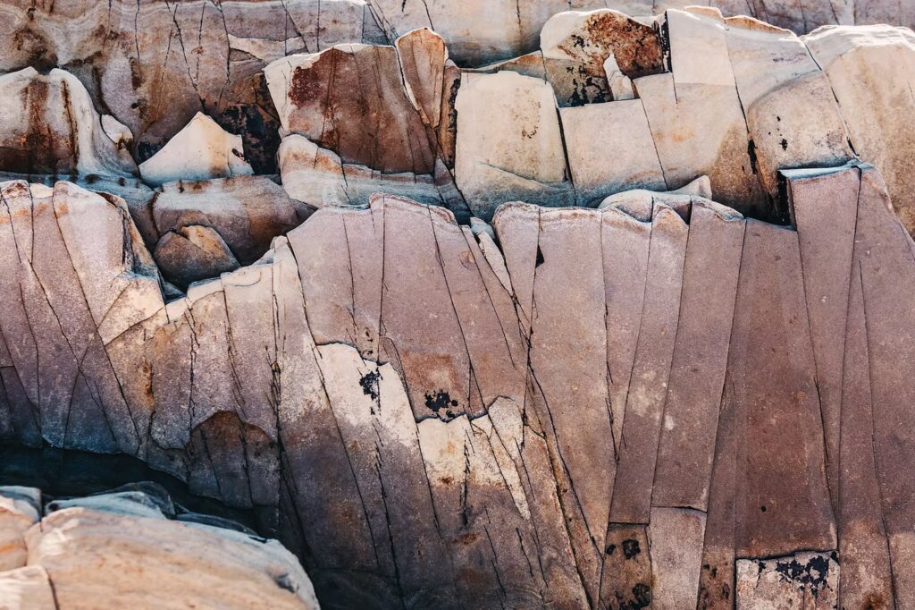 Close-up of weathered rock formations with natural cracks and layered textures.
